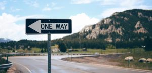 street sign, one way, street, corner, scene, setting, location, god, song, god smoking a cigarette